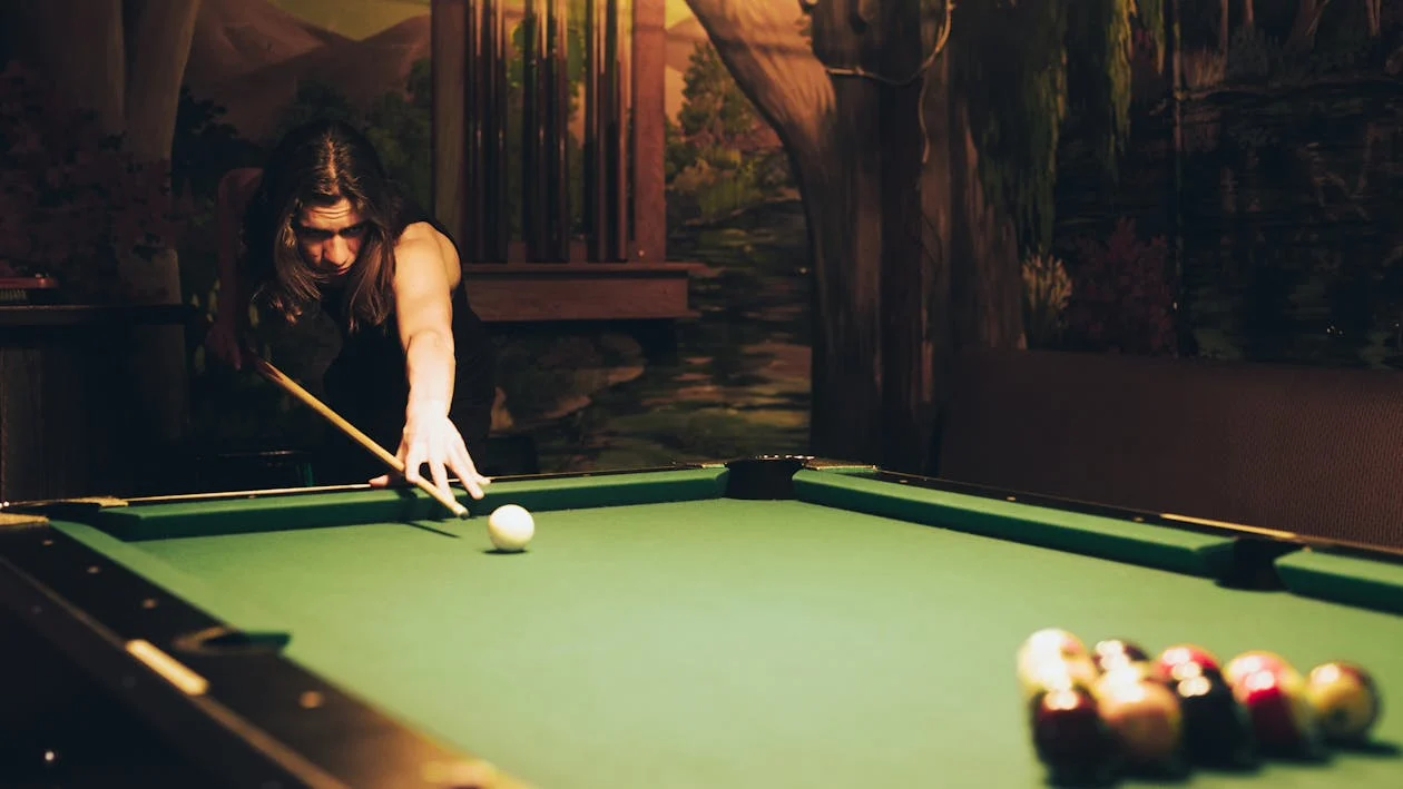 A man playing billiards