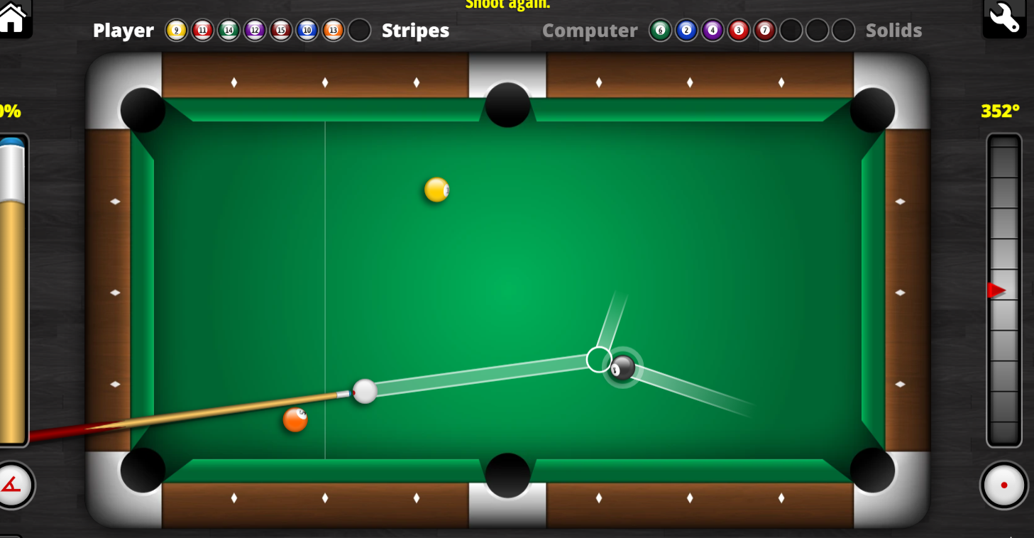 Close-up of 8 ball and cue ball on pool table